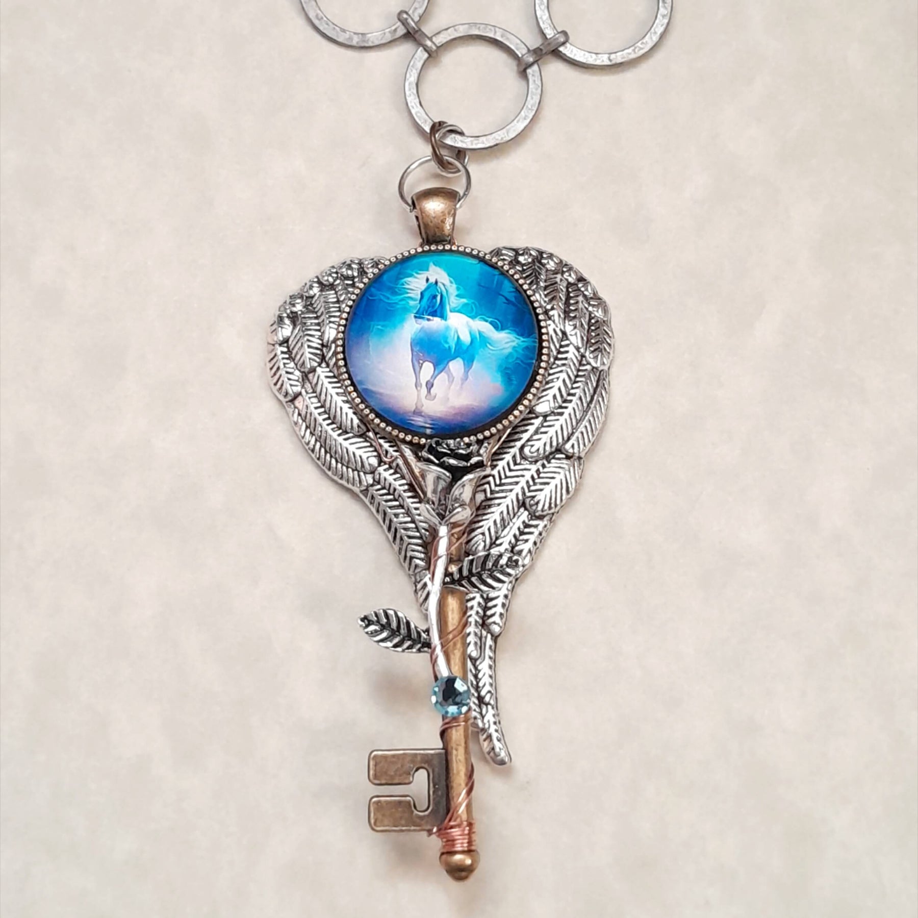 Blue Horse Cabachon Key Wing Necklace