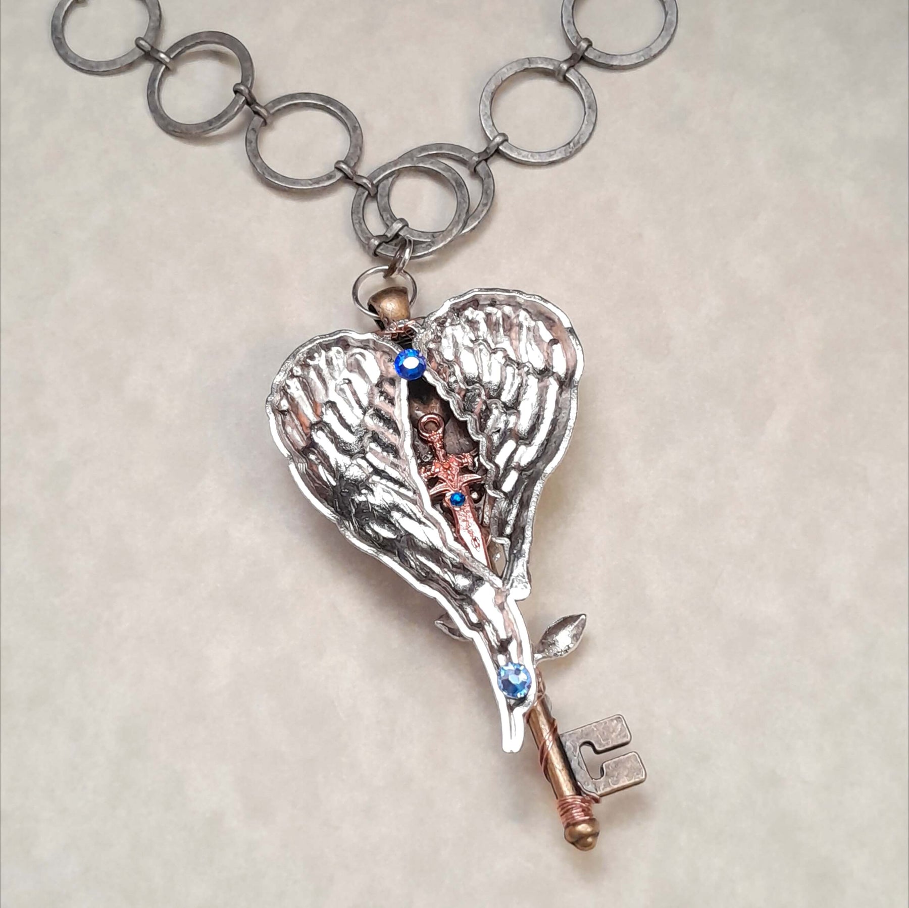 Blue Horse Cabachon Key Wing Necklace